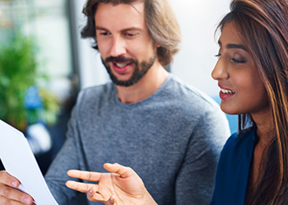 Man and woman looking at survey