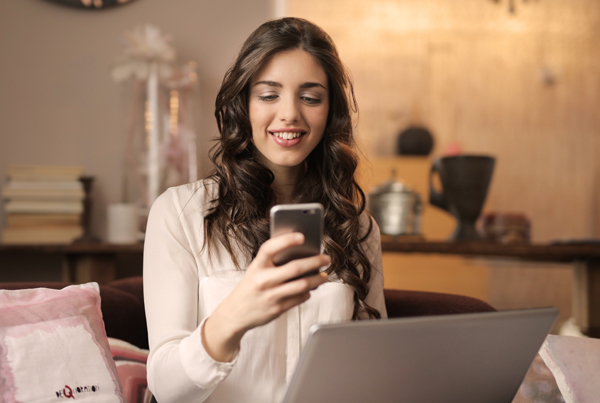 woman looking at cell phone