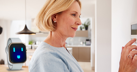 woman adjusting thermostat image