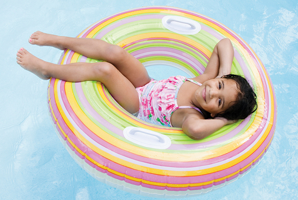 Girl floating on the pool