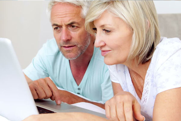 Couple looking at laptop screen