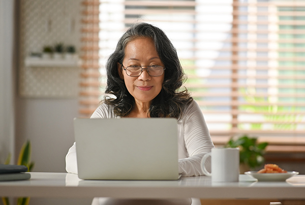 woman looking at her laptop